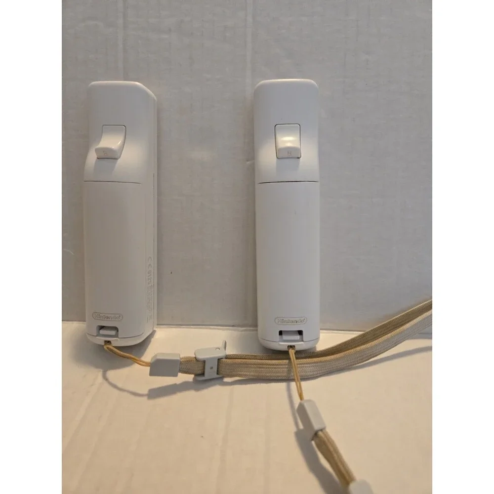 Pair Of Nintendo Wii Remotes With Nunchucks